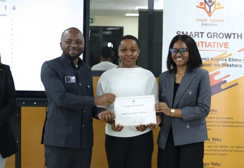 A graduate receives her certificate